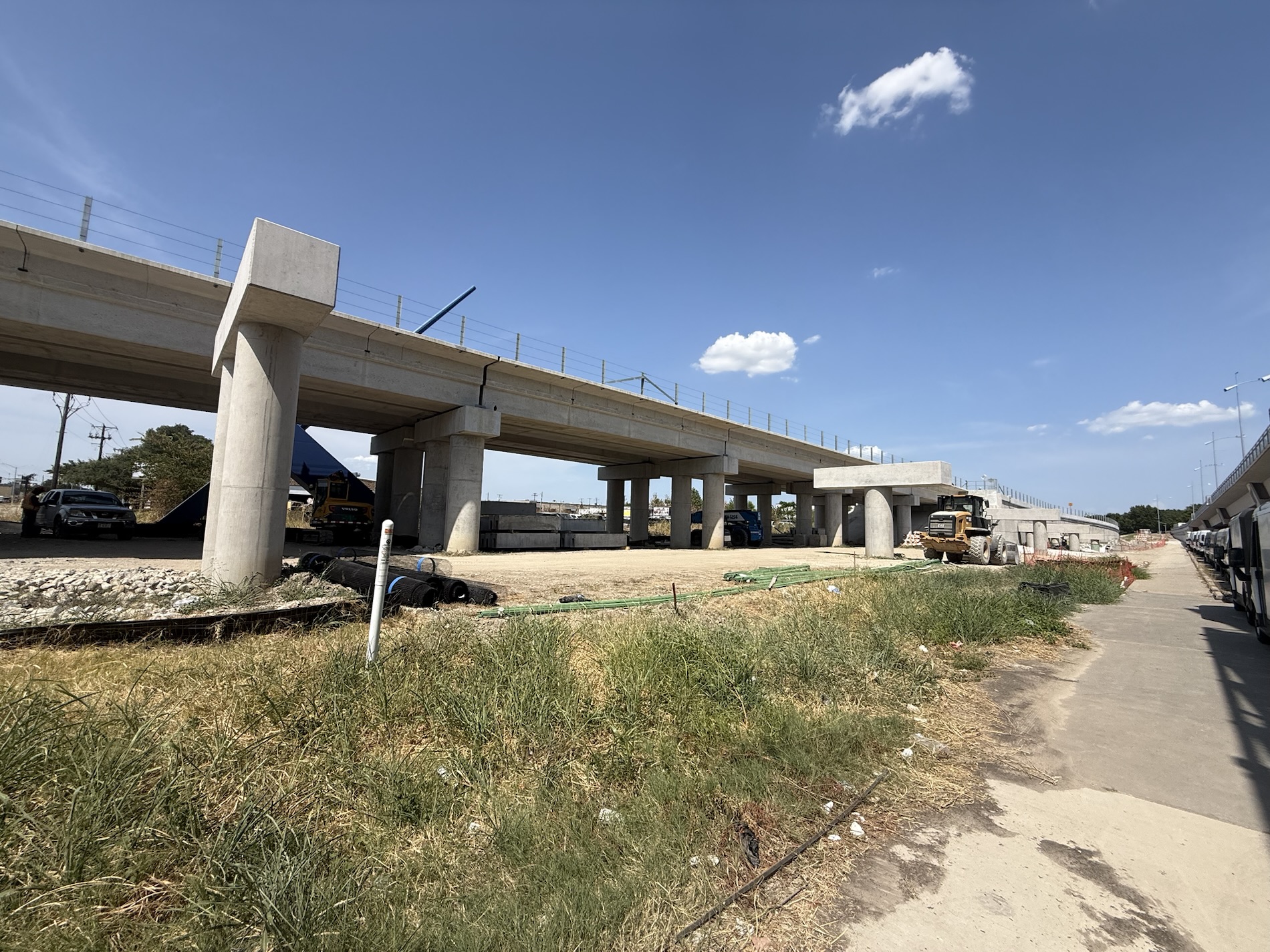 Addison Is About to Get Even More Walkable Construction site at the Midway Road bridge with support columns and the paved trail path visible